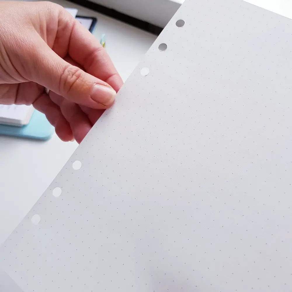 Use an old planner insert as a template to mark holes