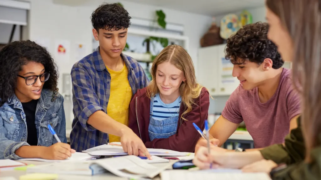 Students and a teacher engaged in a classroom activity at school